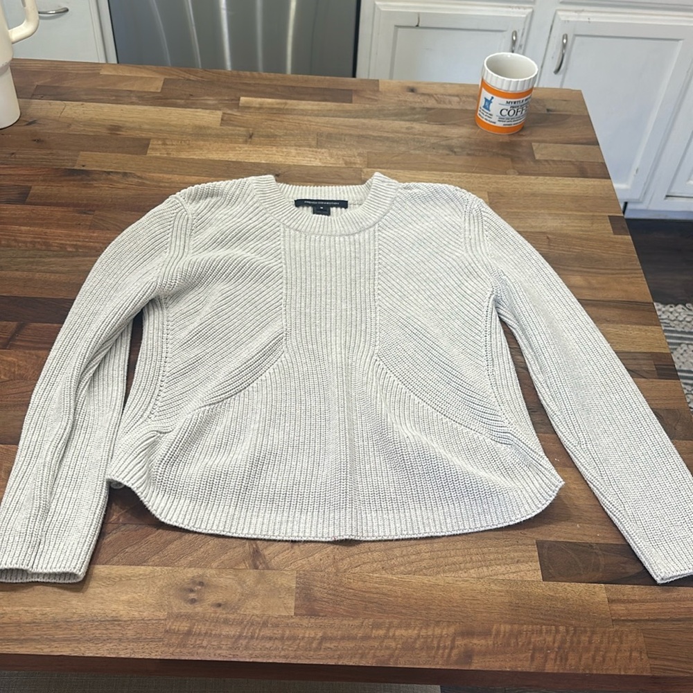 Cream sweaters gently worn
